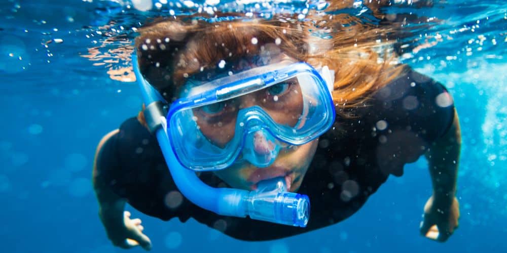 Woman snorkeling in the ocean